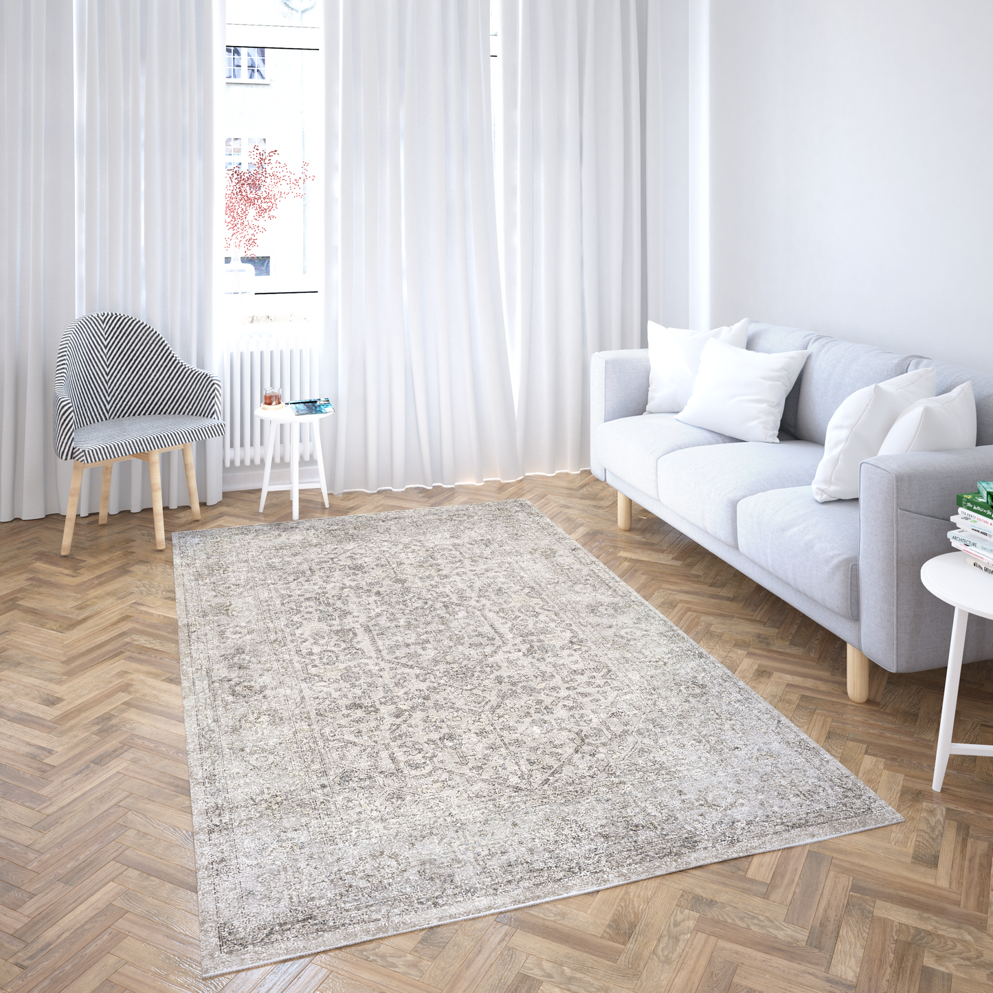Living room with a gray rug, white sofa, and wooden floor.