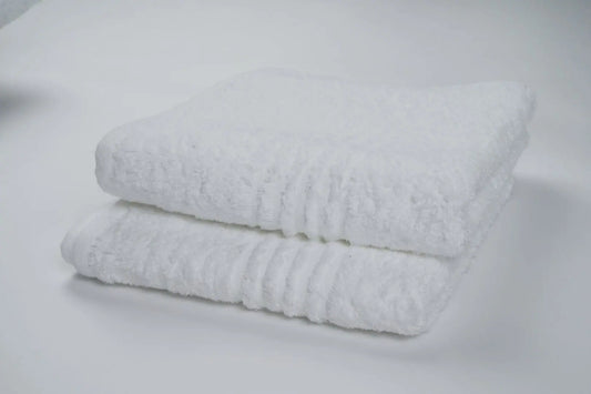 Elegant bath sheet, offering maximum coverage and softness for a luxurious bathing experience.
