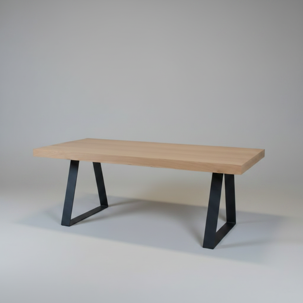 Wooden table with black metal legs on a plain background