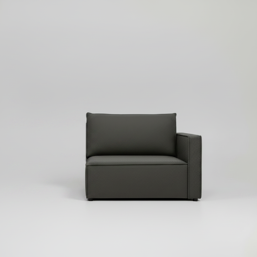 Gray fabric armchair with a pillow on a light gray background
