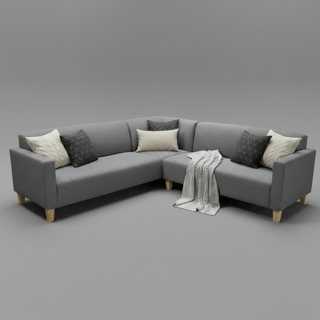 A modern L-shaped gray fabric sectional sofa with light wood legs, styled with cream and dark gray throw pillows and a white knit blanket, set against a solid gray studio background.