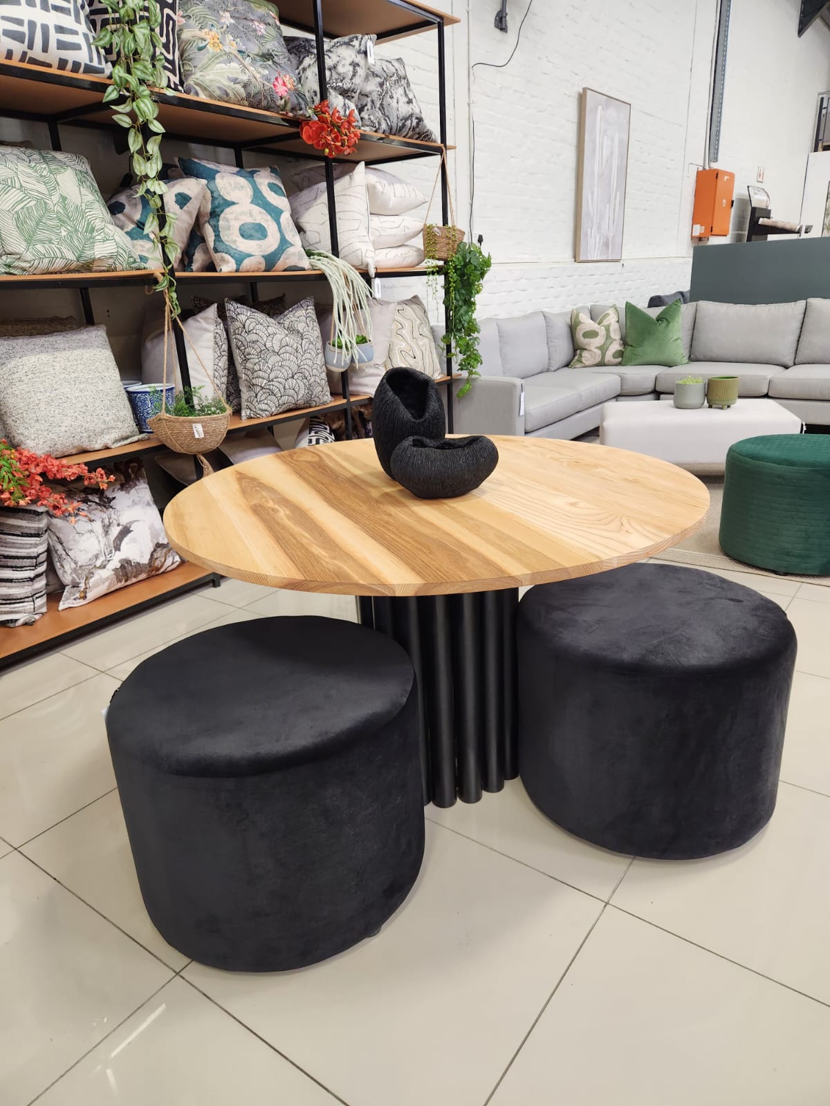 Round Fragmented Dining Table with oak veneer top and black steel tube base.