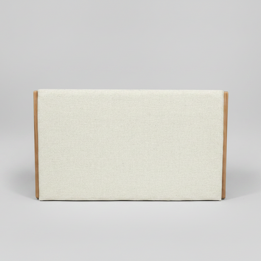 Headboard in cream with wooden sides on a gray background