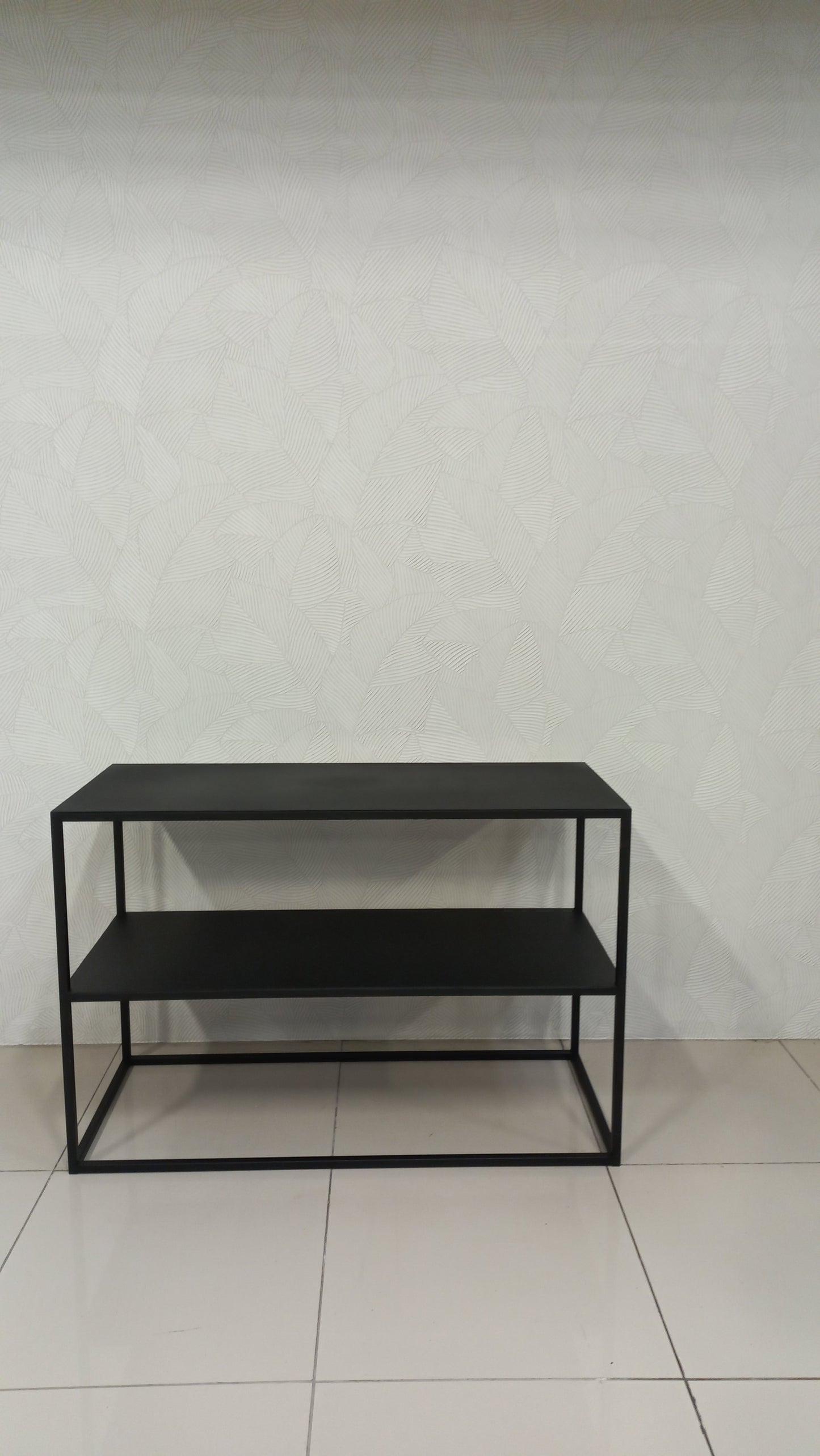 Metal console table in black steel with two shelves.