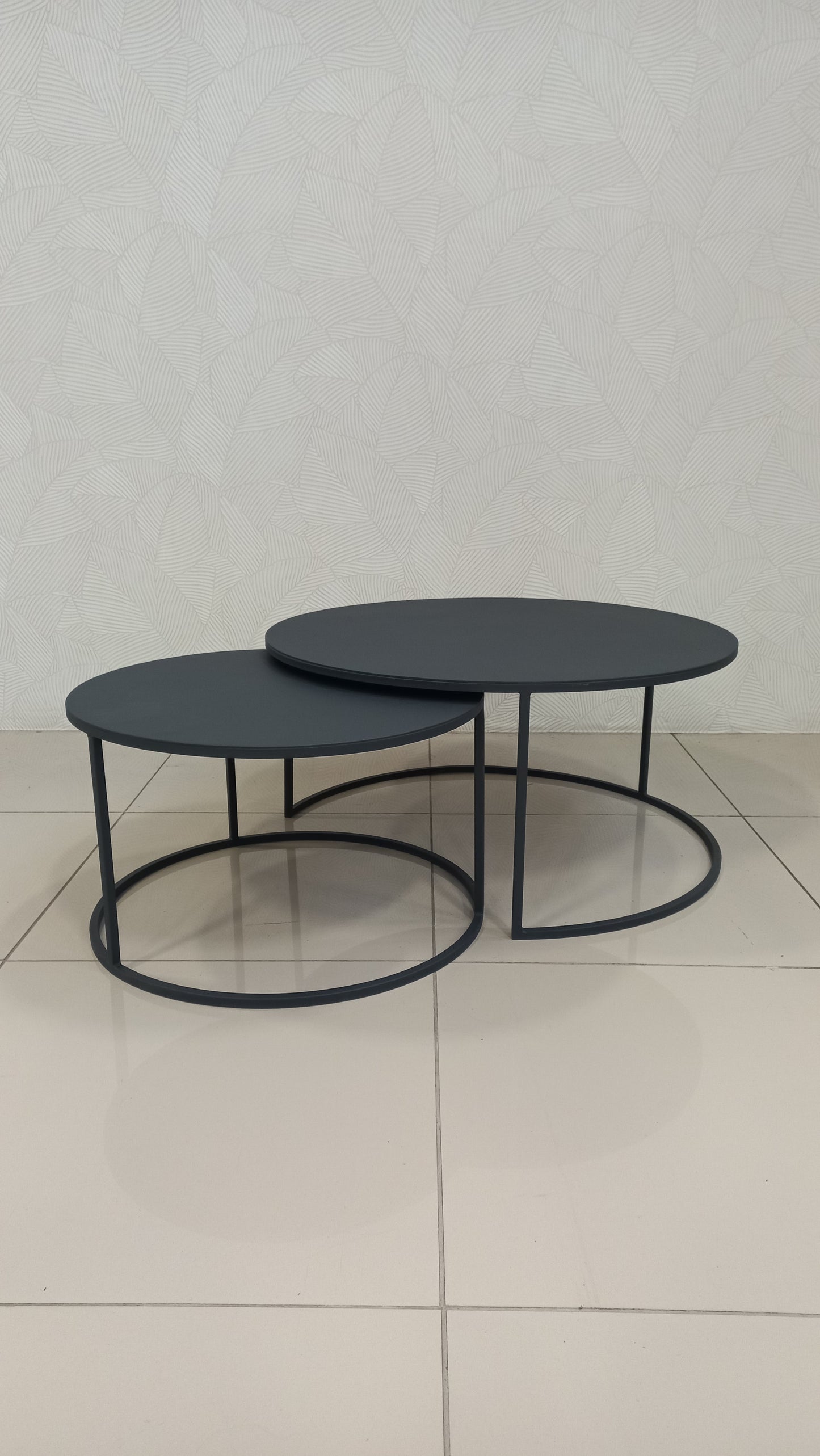 leek Black Round Nesting Table Set crafted from black epoxy-coated steel.