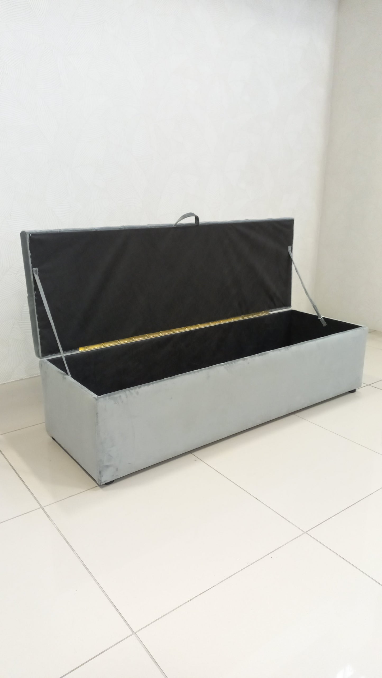 Deep Button Storage Ottoman with tufted lid and hidden storage.