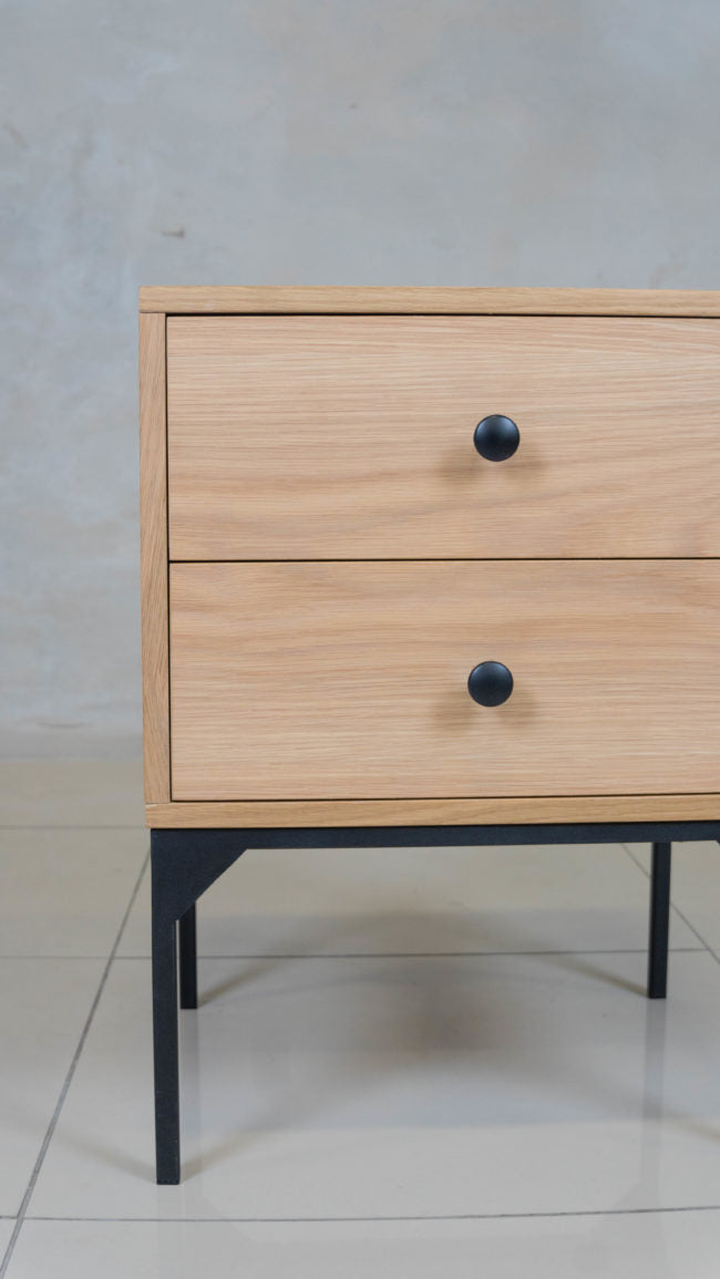 Lupen nightstand with two drawers, offering sleek and functional bedroom storage.