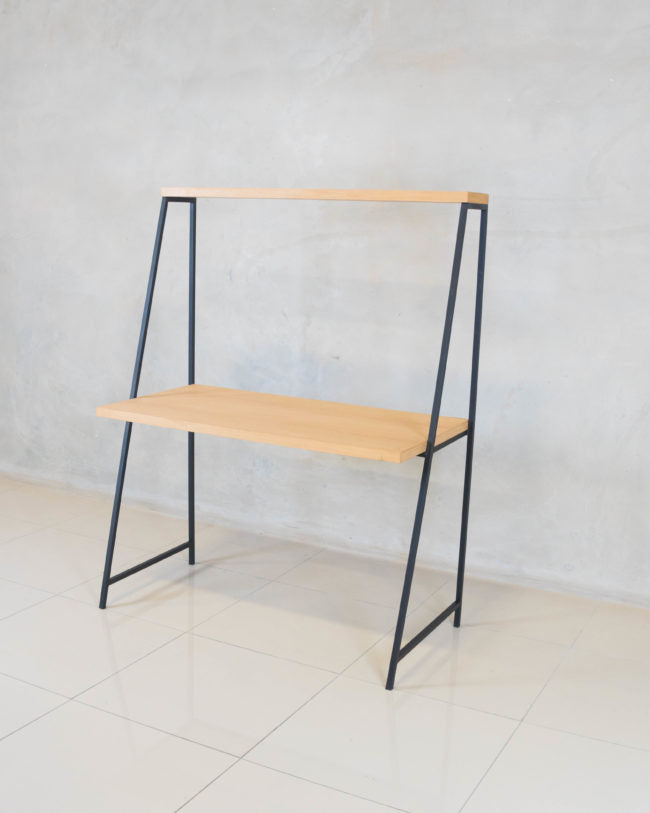 Side view of the Milly Desk showcasing its top shelf for additional storage.