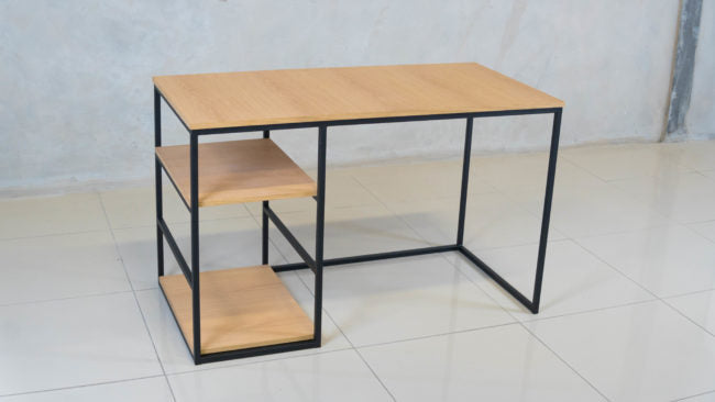 Side view of the Harvard Desk, showcasing its modern design with bottom shelves.