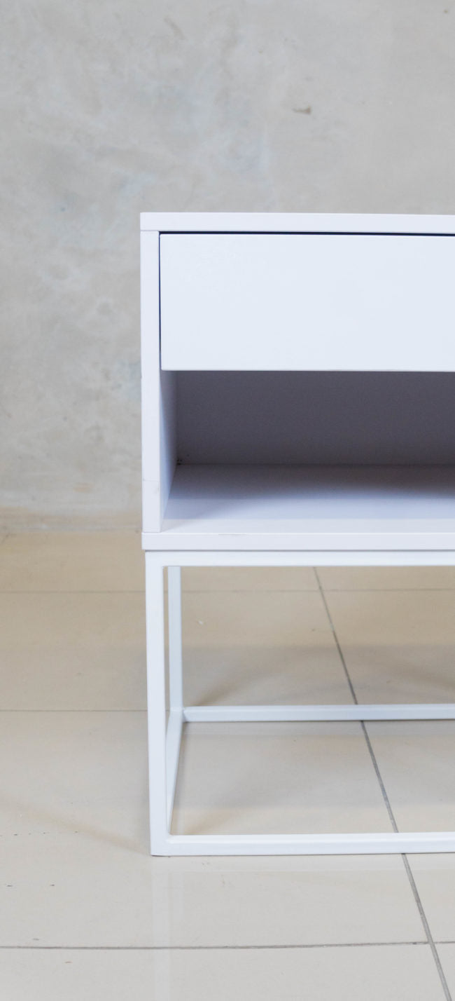 Modern white melamine nightstand, perfect for small bedrooms or guest rooms.