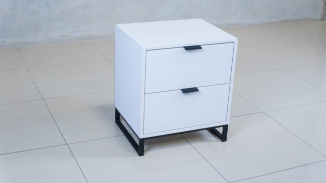 Modern white melamine bedside table featuring smooth ball-bearing drawer runners.