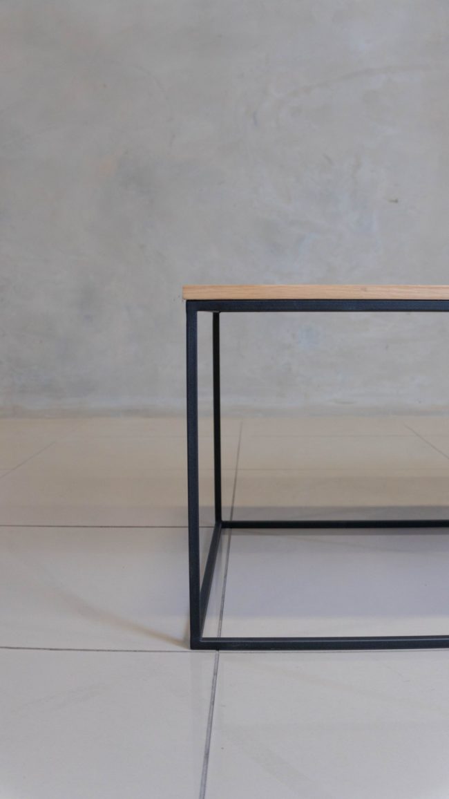 Minimalist black steel coffee table, perfect for modern spaces.