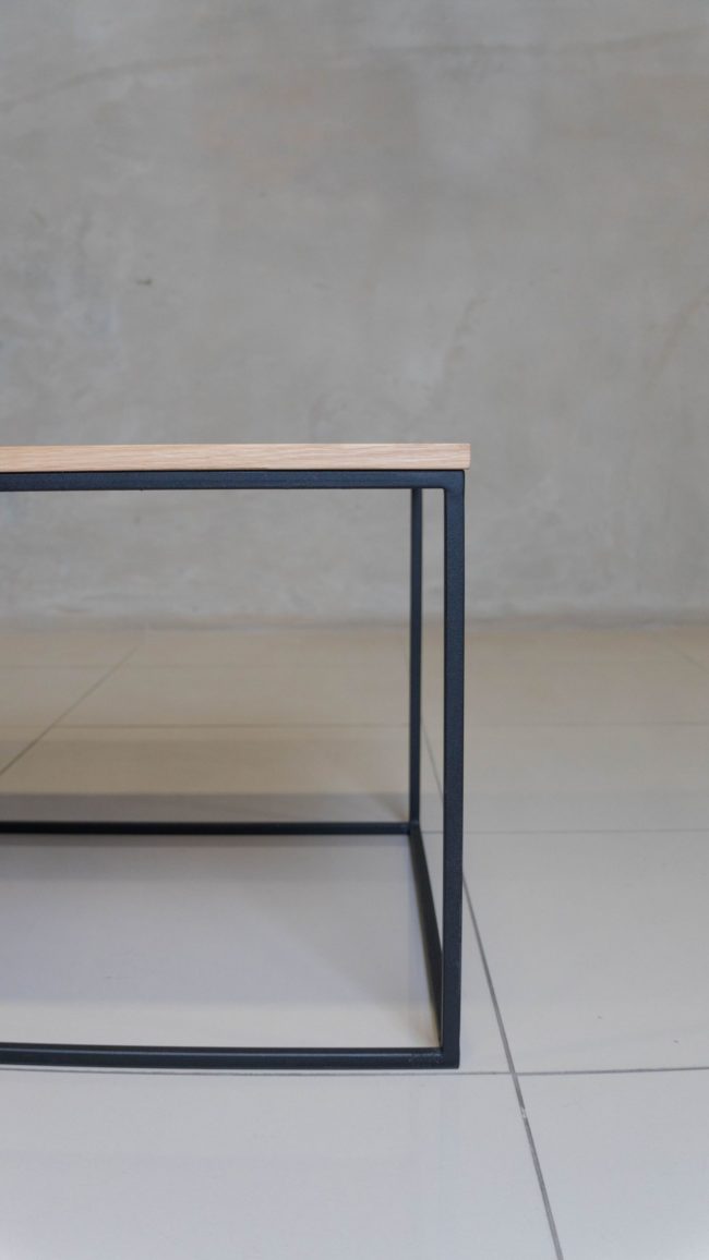 Minimalist black steel coffee table, perfect for modern spaces.