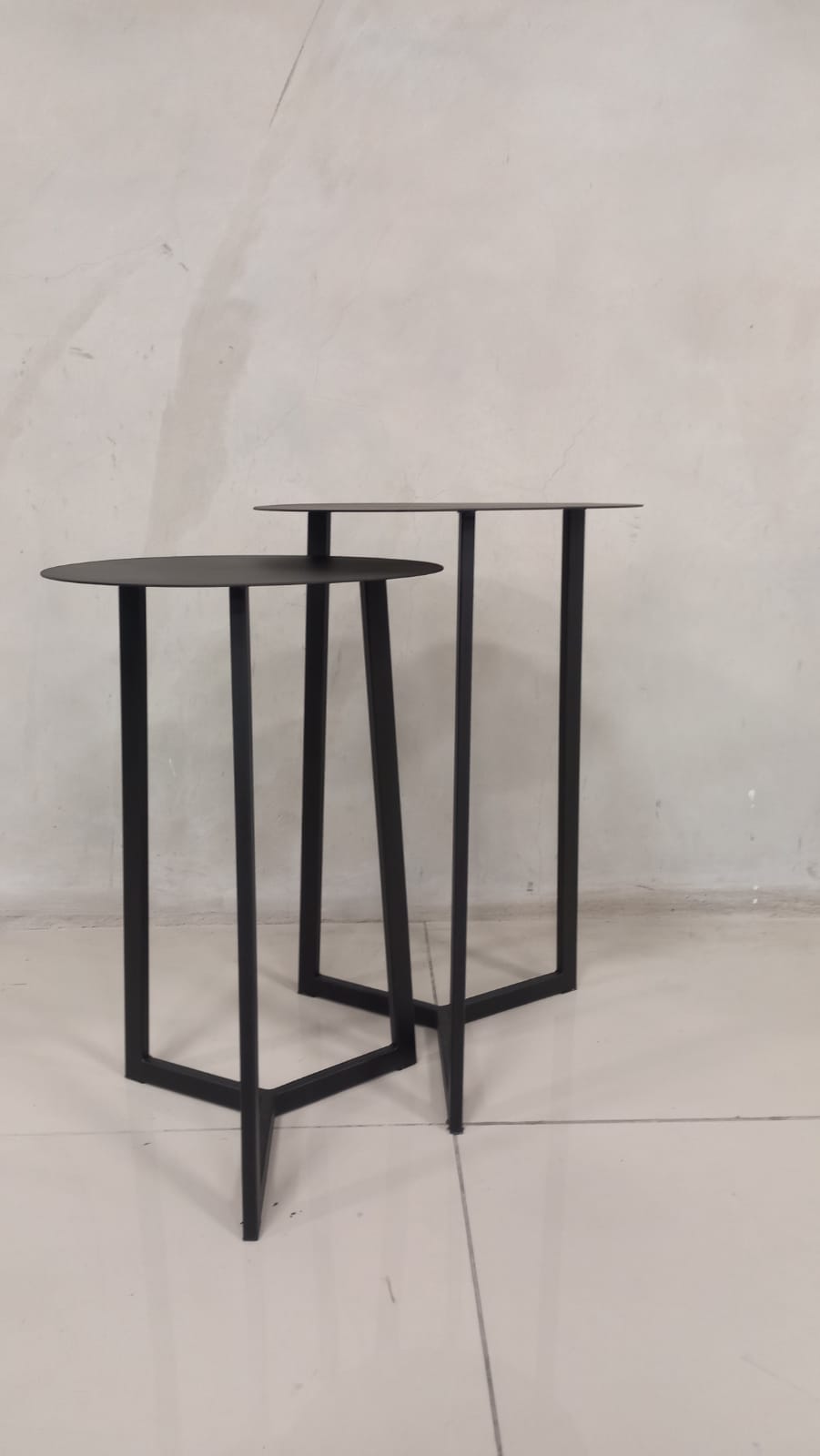 Compact Black Forest nesting coffee tables with durable steel frames and sleek design.