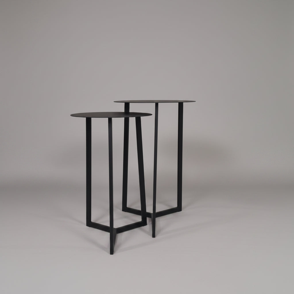 Compact Black Forest nesting coffee tables with durable steel frames and sleek design.