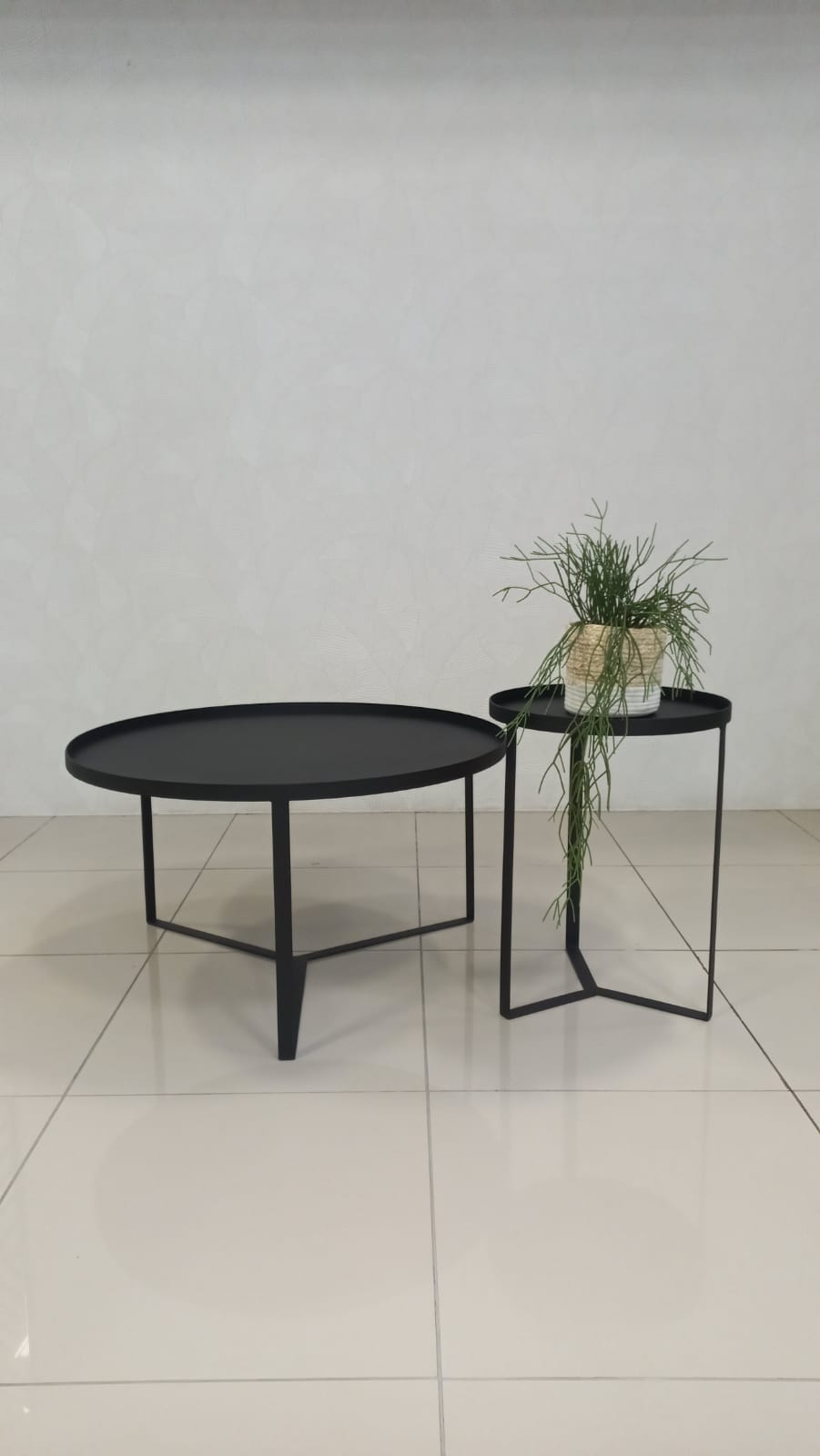 Saffron nesting coffee table set in black epoxy steel.