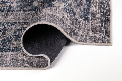 Close-up of a textured rug with a rolled edge on a white background