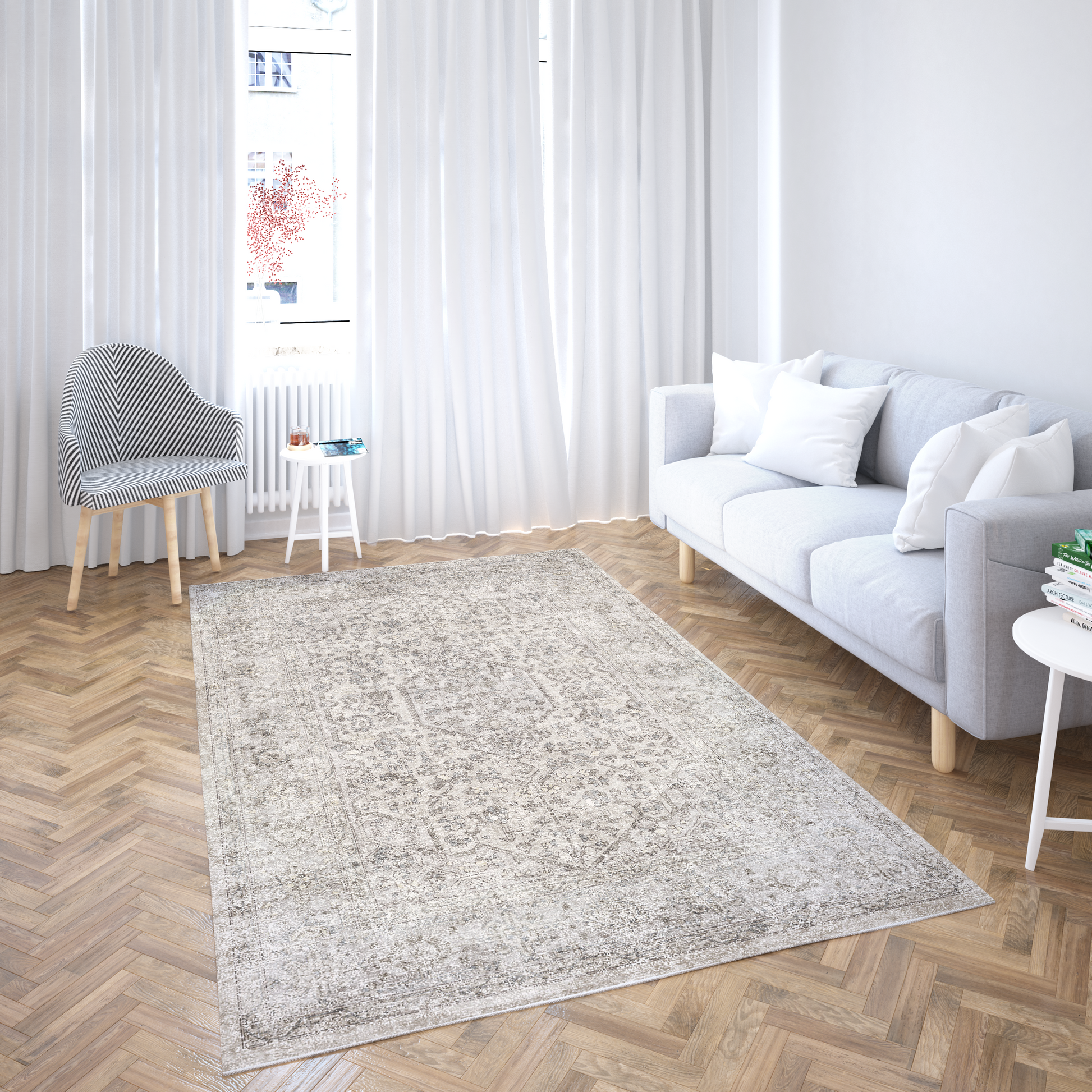 Living room with a gray rug, white sofa, and wooden floor.
