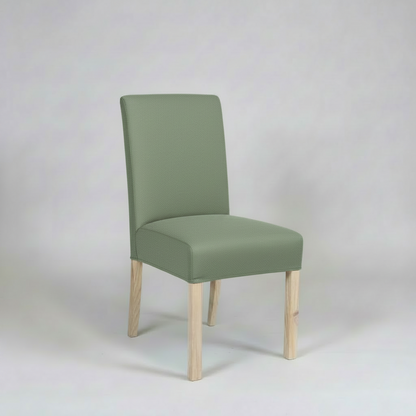 Green chair with wooden legs on a white background
