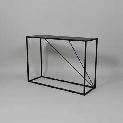 Black metal console table on a gray background