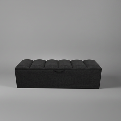 Black ottoman on a gray background