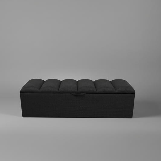 Black ottoman on a gray background