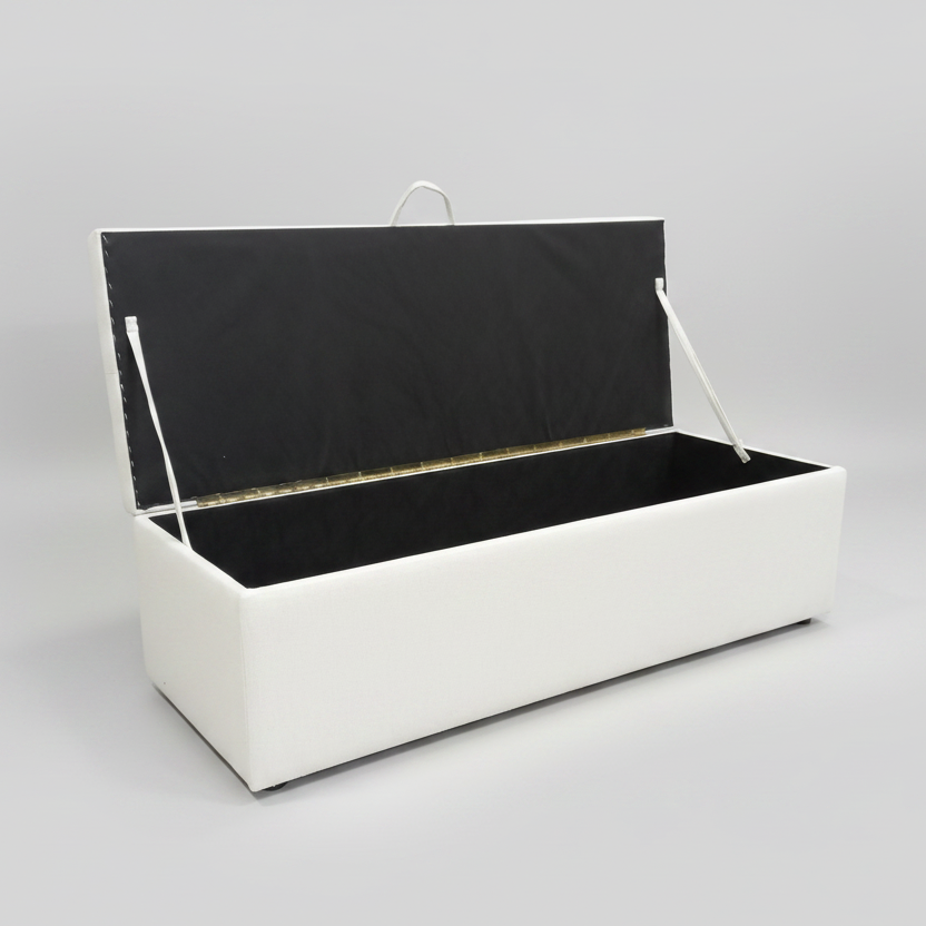 White storage bench with black seat on a gray background