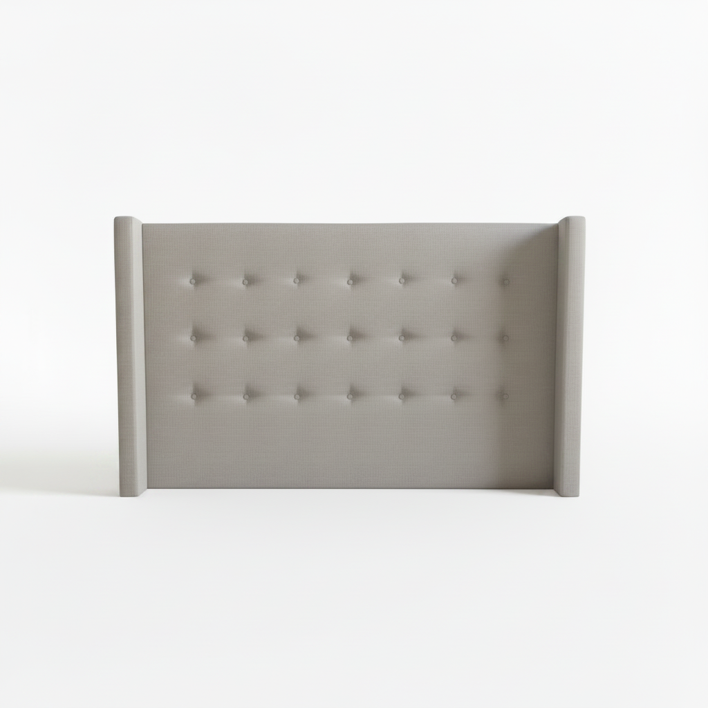Gray tufted headboard on a white background