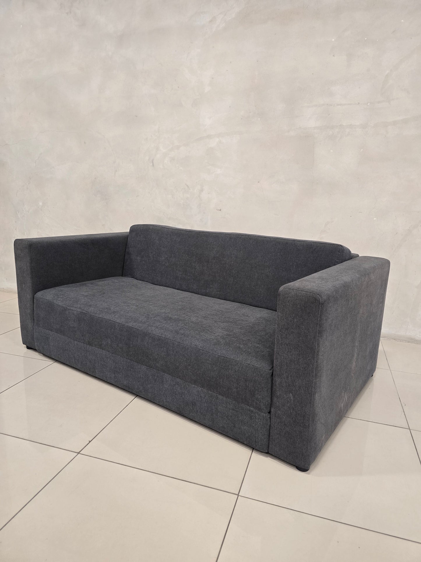 Compact sleeper sofa for studio apartments and guest bedrooms.