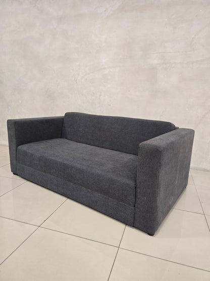 Compact sleeper sofa for studio apartments and guest bedrooms.