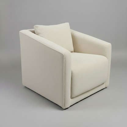 Beige armchair with a pillow on a gray background