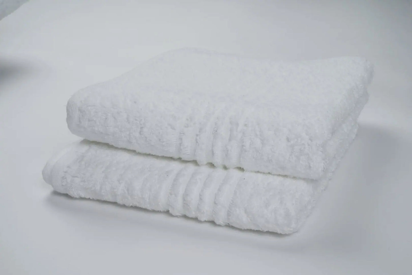 Elegant bath sheet, offering maximum coverage and softness for a luxurious bathing experience.