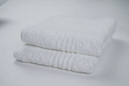 Elegant bath sheet, offering maximum coverage and softness for a luxurious bathing experience.