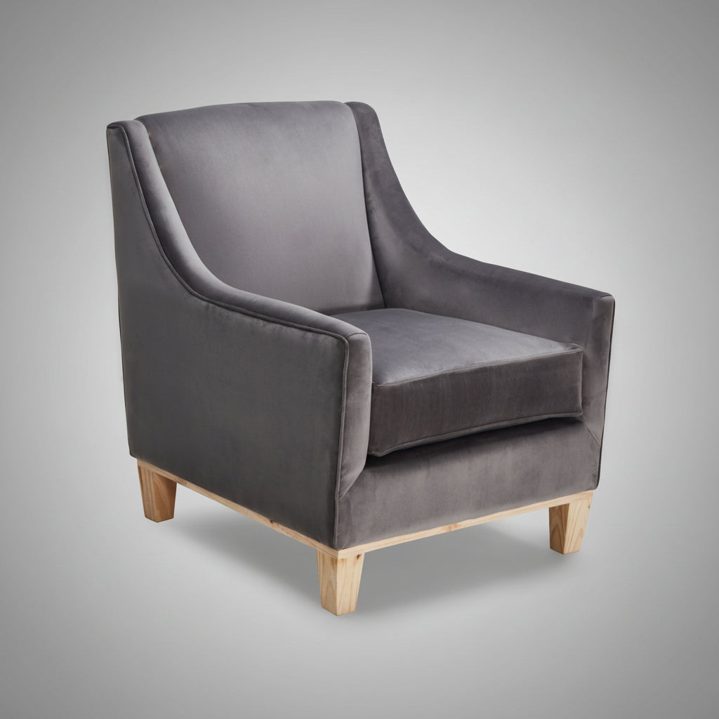 Gray velvet armchair with wooden legs on a white background
