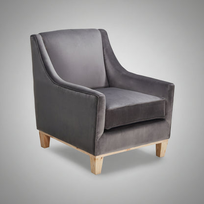 Gray velvet armchair with wooden legs on a white background