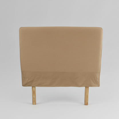 Brown headboard on a wooden bed frame against a white background