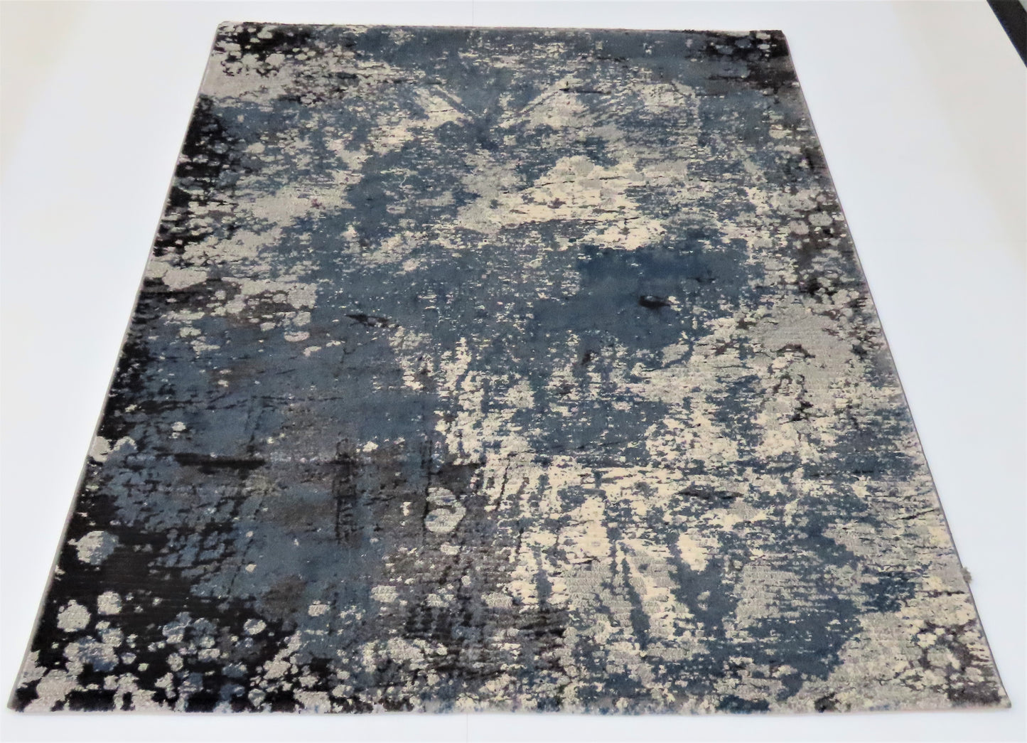 Abstract patterned rug on a white background