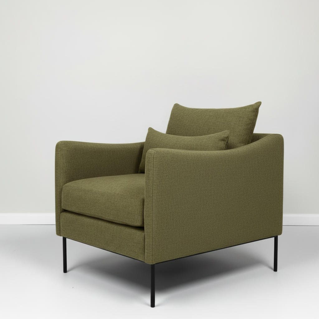 Green armchair with two cushions on a white background