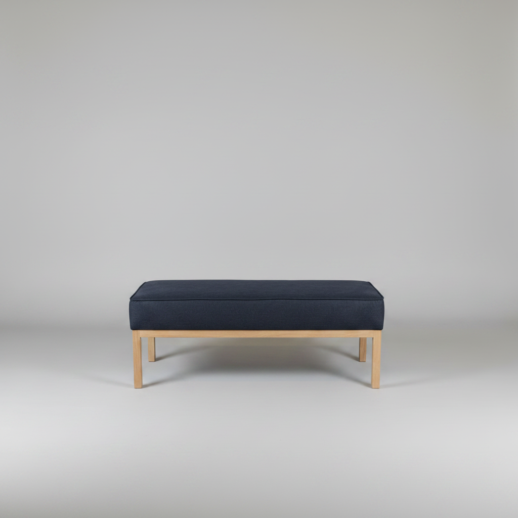 Navy bench with wooden legs on a plain background