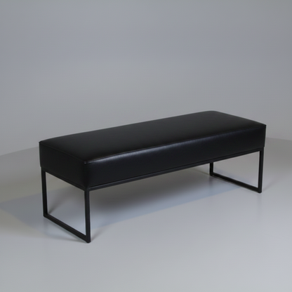 Black bench with metal legs on a plain background