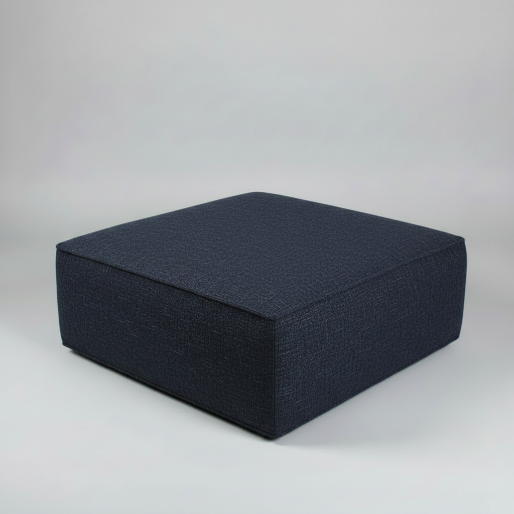Dark blue ottoman on a light gray background