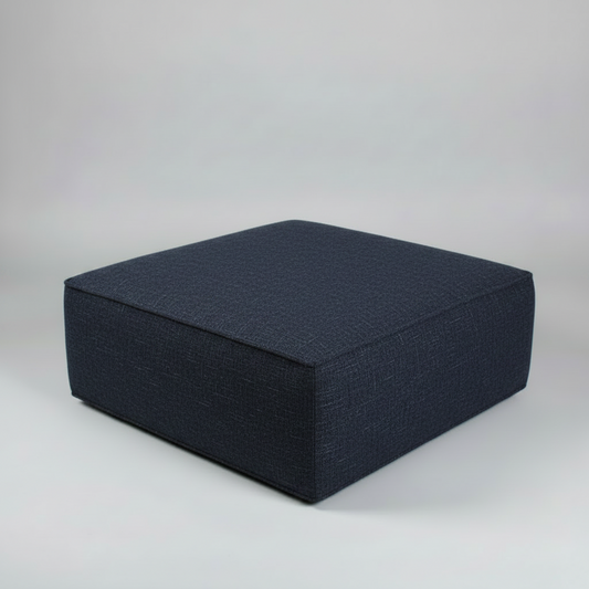 Dark blue ottoman on a light gray background