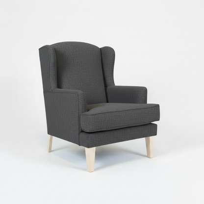 Gray wingback chair on a white background