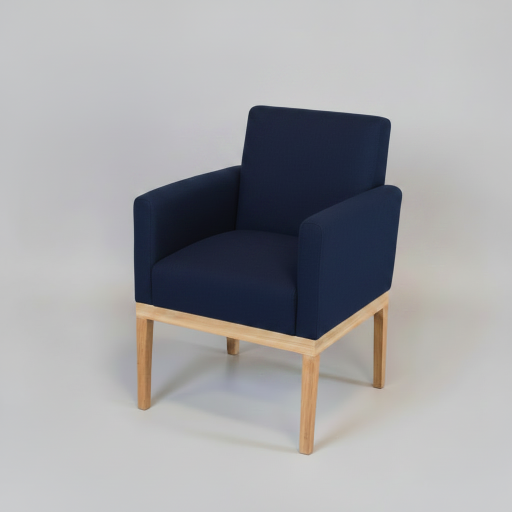 Navy blue armchair with wooden legs on a light gray background