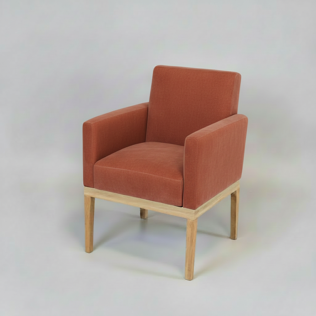 Red armchair with wooden legs on a white background