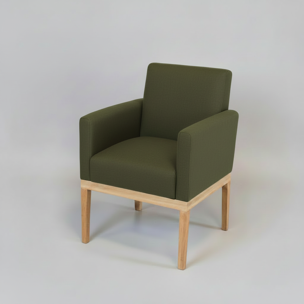 Green armchair with wooden legs on a light gray background