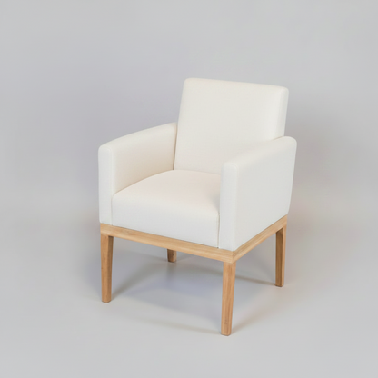 Gray armchair with wooden legs on a light gray background