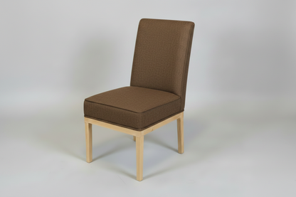 Brown upholstered chair with wooden legs on a white background