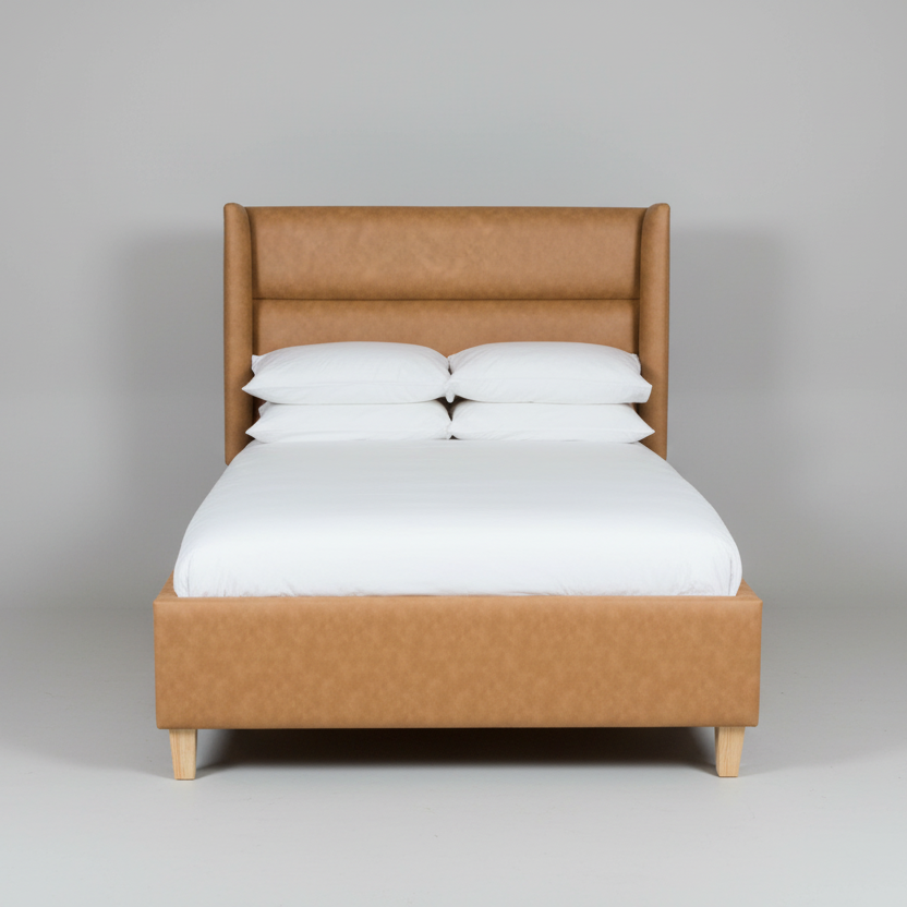 Brown upholstered bed with white mattress and pillows on a gray background