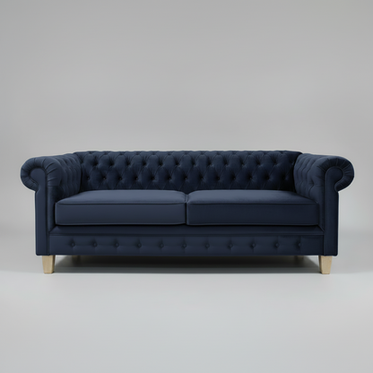 Navy blue tufted sofa on a light gray background